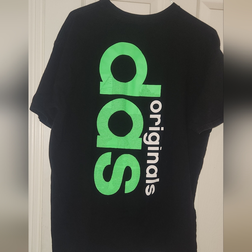 Adidas originals black with green print letters.